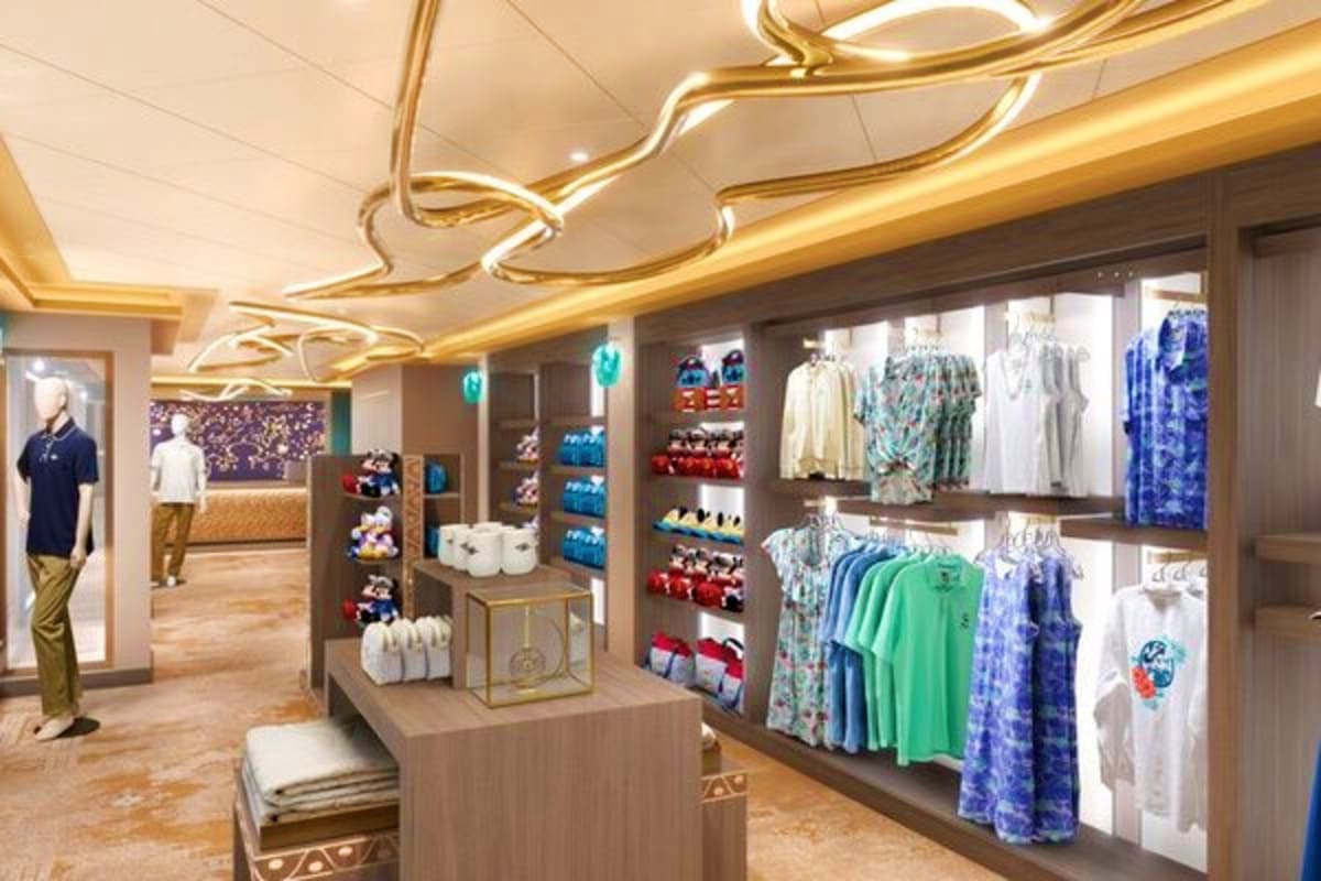 Modern retail clothing store interior with gold lighting, displaying colorful garments, accessories, and merchandise on illum