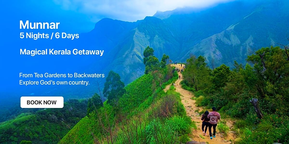 Hiker trekking on mountain trail in Munnar, Kerala with lush green hills and distant mountains in background