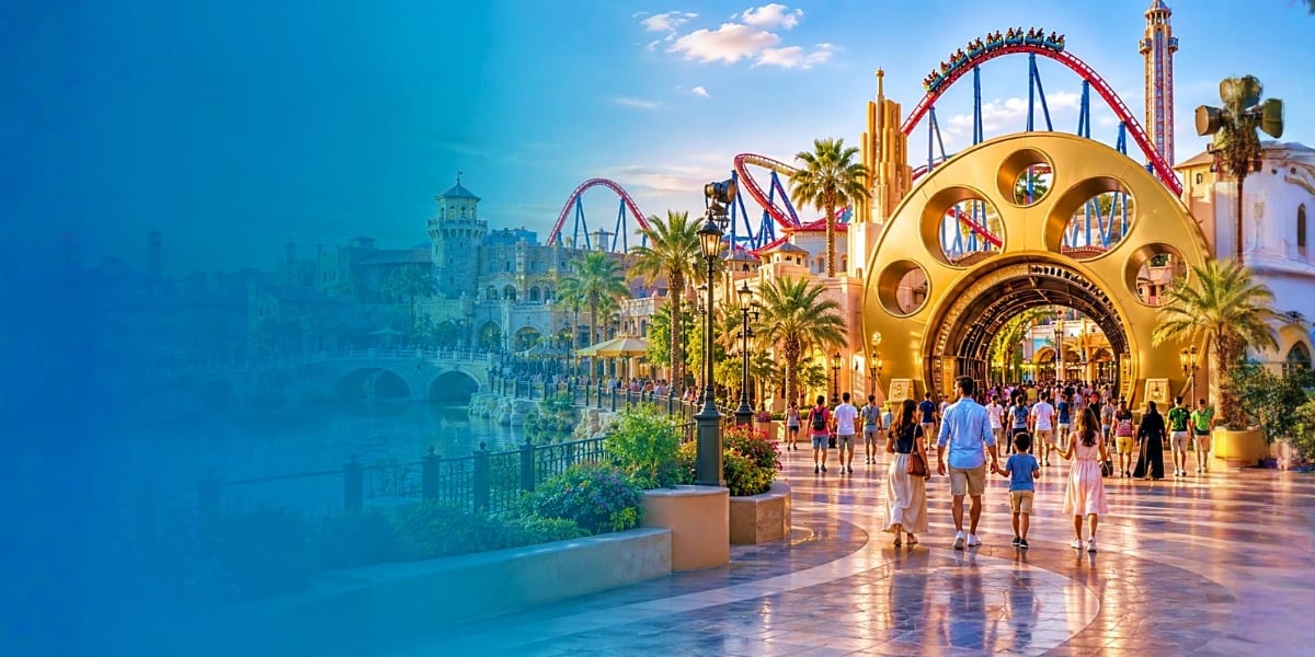 Visitors walking through Dubai Parks and Resorts with colorful roller coasters, palm trees, and golden architectural structur