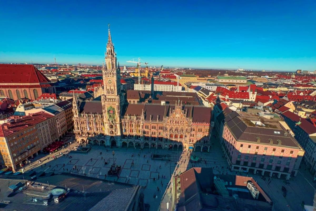 Discover Munich Old Town Guided Walking Tour Aerial view of Munich's Marienplatz with the Gothic New Town Hall and its spire dominating the historic square surrounded by