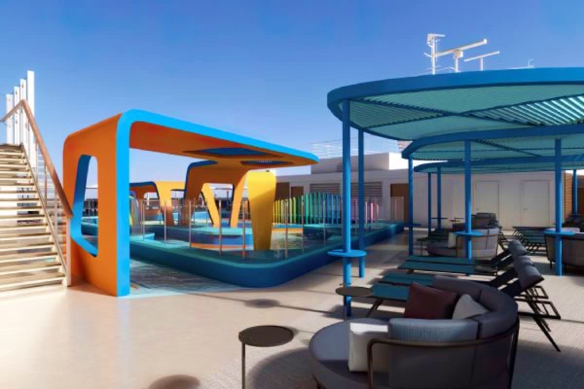 Modern cruise ship deck with colorful orange and blue canopy structure, lounge seating area, and clear blue sky