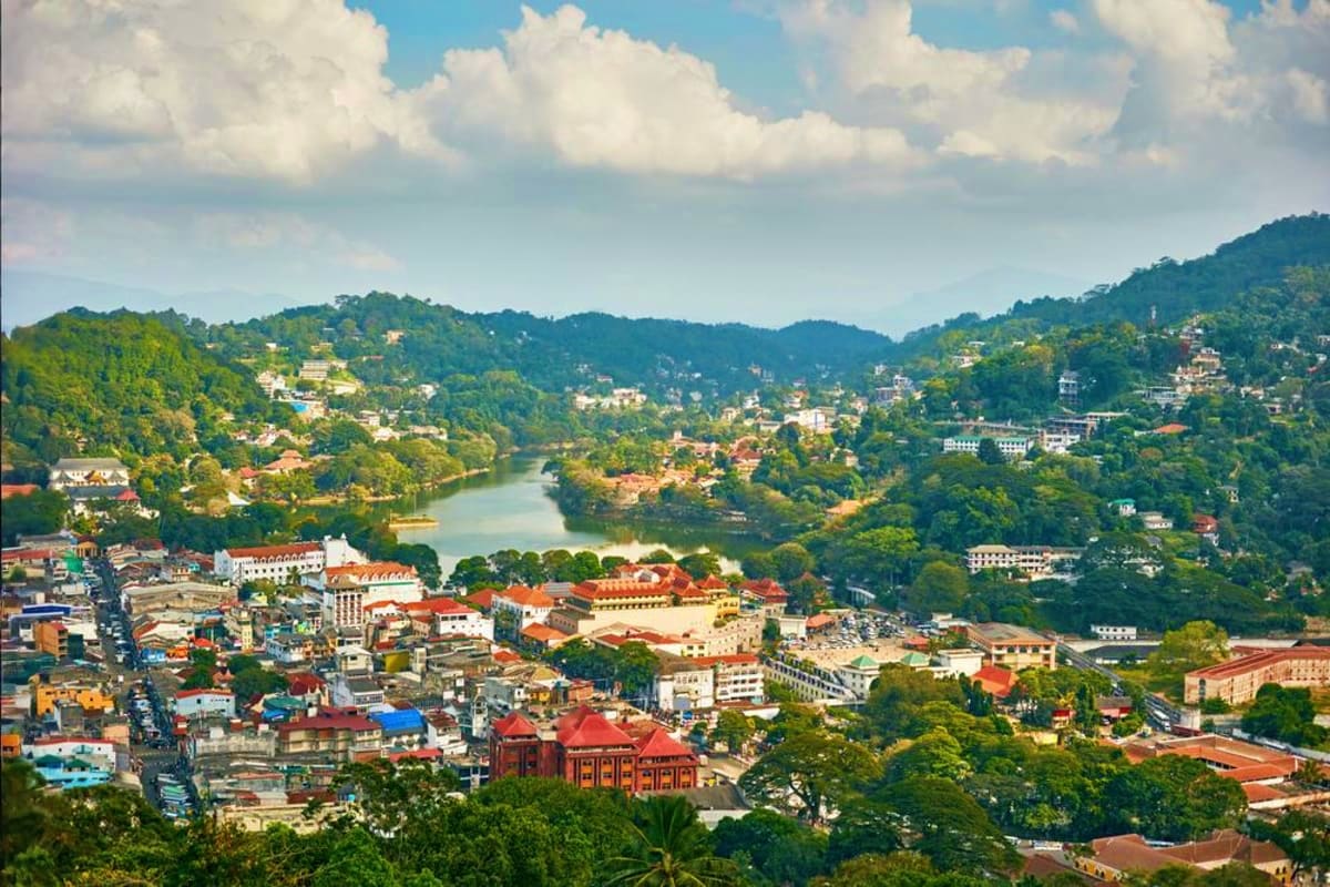 Wildlife Safari Tour Aerial view of Kandy, Sri Lanka with colonial buildings, river, and forested hills