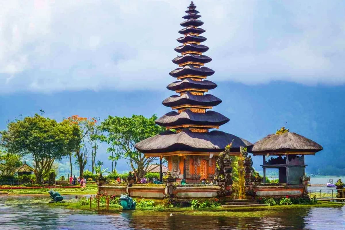 Bali & Nusa Penida Discovery Pura Ulun Danu Bratan temple with multi-tiered pagoda roof on lake in Bali, Indonesia, surrounded by mountains and tropical v