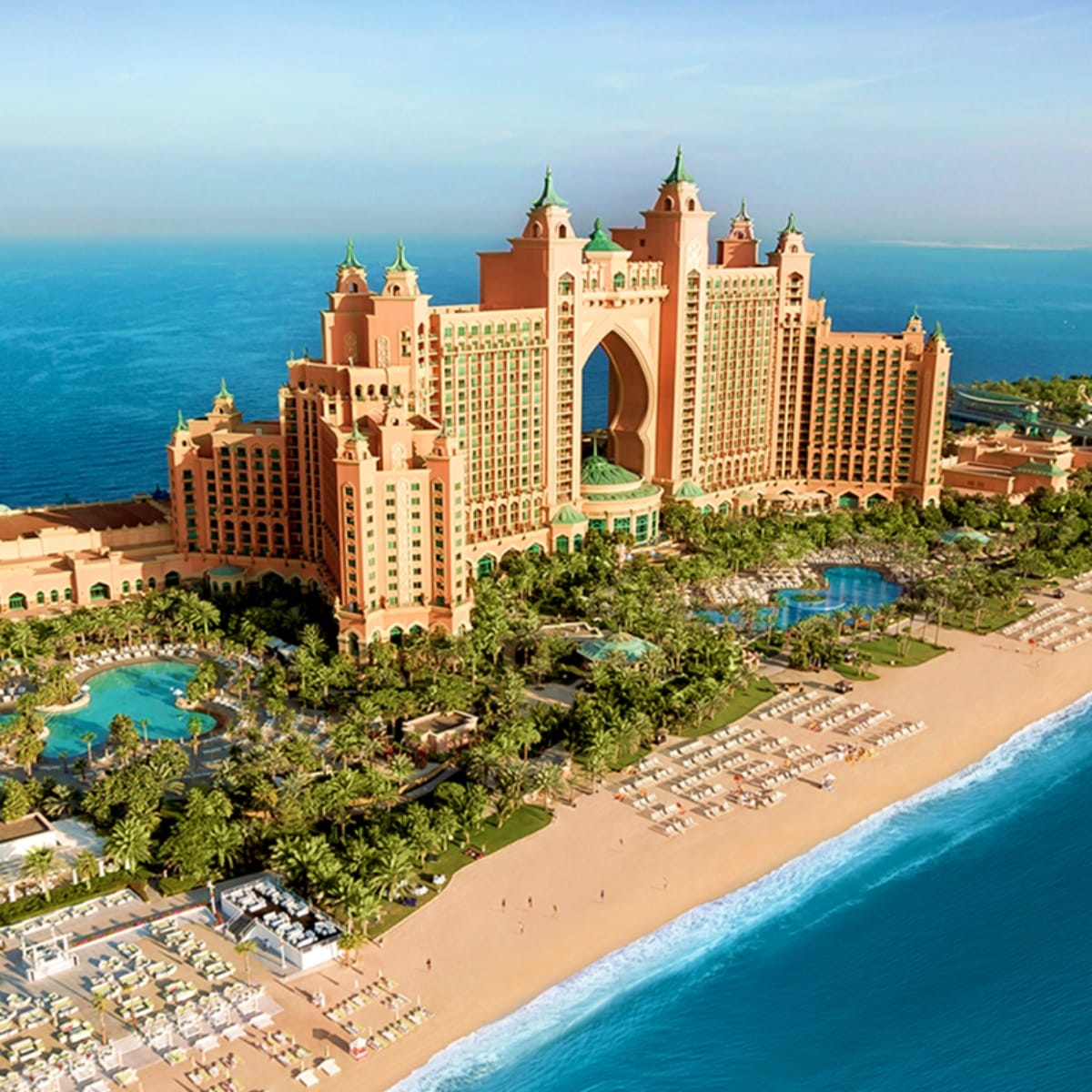 Aerial view of Atlantis The Palm luxury resort in Dubai with beachfront, pools, and Arabian Gulf waters