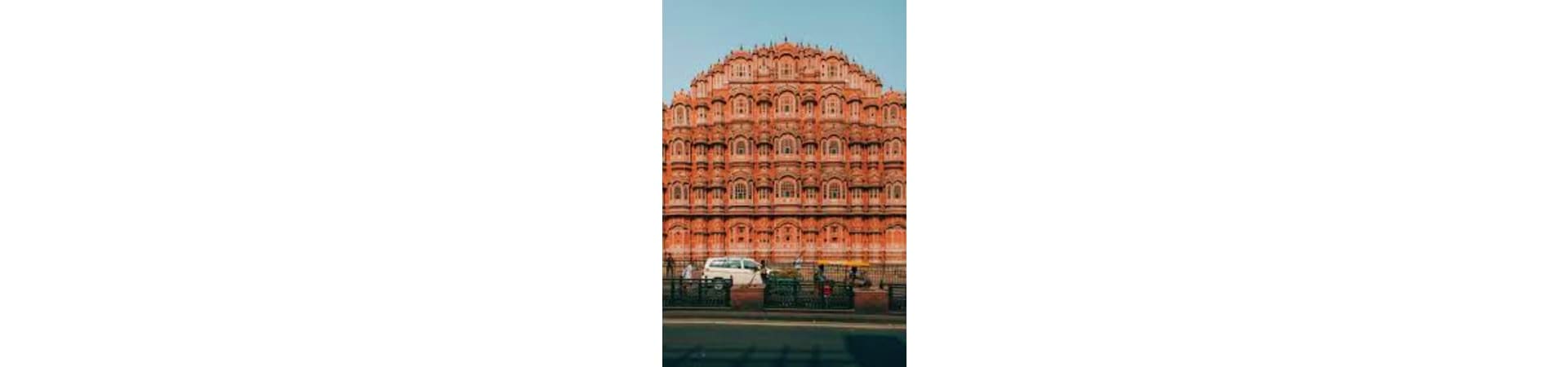 Hawa Mahal palace with pink terracotta facade and small arched windows in Jaipur, India