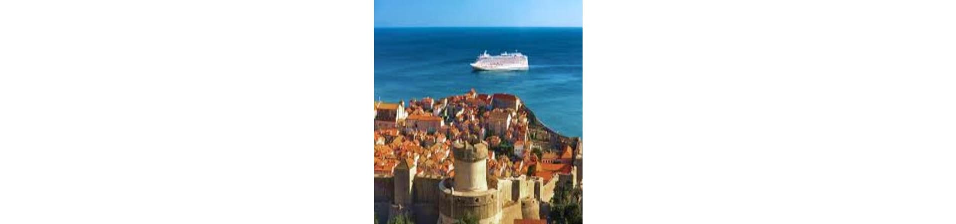 Cruise ship anchored off the coast of Dubrovnik's walled Old Town with terracotta roofs and historic fortifications