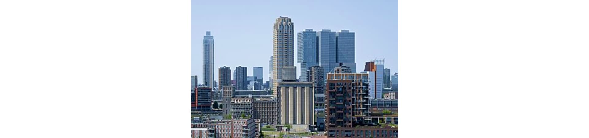 Manhattan skyline with art deco and modern skyscrapers under clear blue sky
