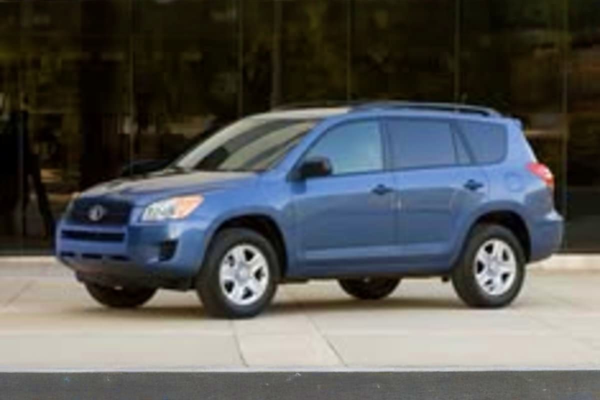 Blue Toyota RAV4 compact SUV parked on urban street for city transfer service