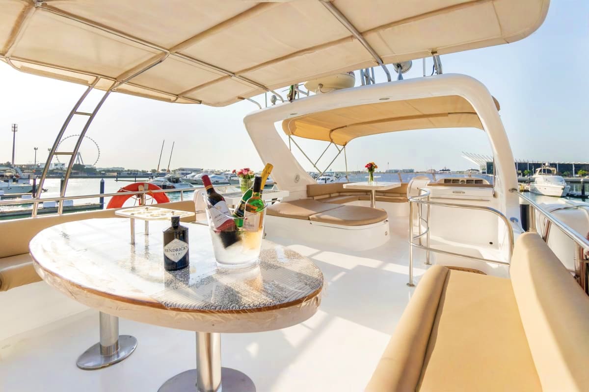 61 Ft Silver Creek Yacht deck with dining table, champagne, and marina view