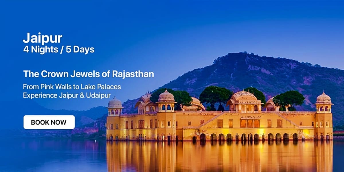 Water Palace in Jaipur, Rajasthan illuminated at dusk reflected in calm lake water with mountain backdrop