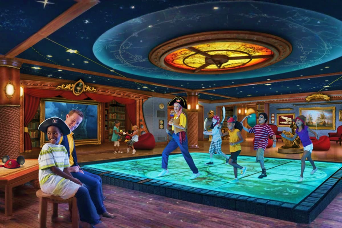 Children and adults in pirate costumes dancing and playing in an interactive indoor entertainment room with glowing floor and