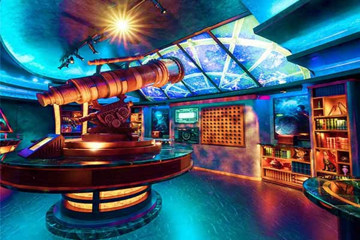 Modern planetarium interior with telescope exhibits, blue atmospheric lighting, solar panel ceiling, and interactive display 