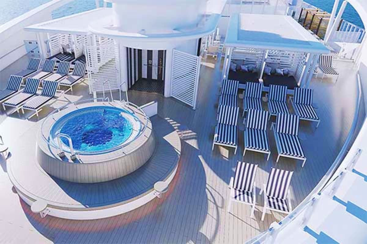 Cruise ship deck with circular hot tub, striped lounge chairs, white cabanas, and ocean view in background