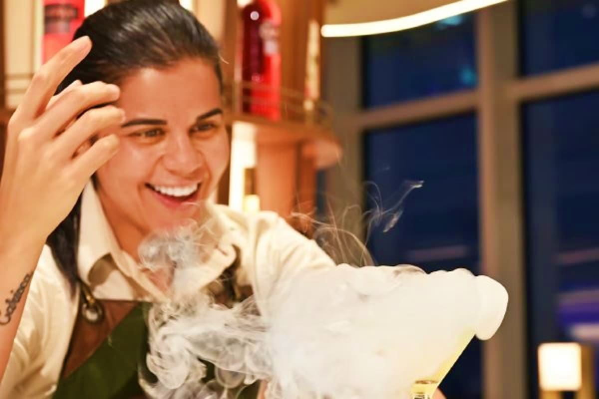 Woman enjoying foam party entertainment on a cruise ship deck at night