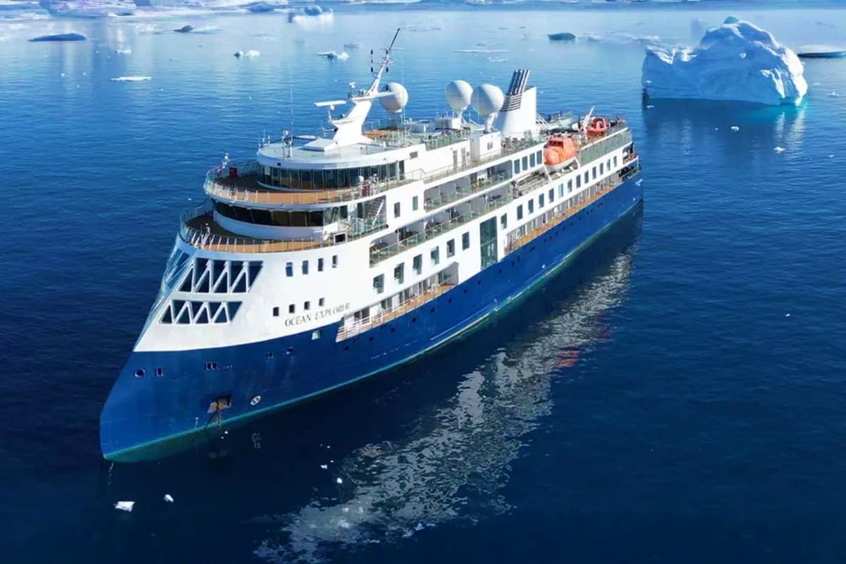 Arctic Expedition with Quark Expeditions aboard Ocean Explorer Ocean Explorer cruise ship navigating icy Arctic waters surrounded by icebergs and glacial ice floes