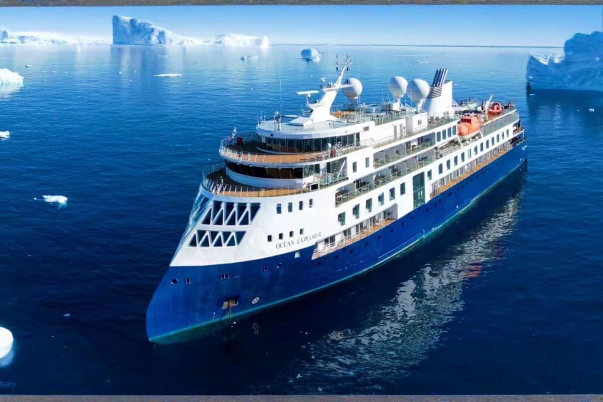 Arctic Wonders of Greenland and Iceland Ocean Explorer II cruise ship navigating through icebergs in Arctic waters near Greenland and Iceland