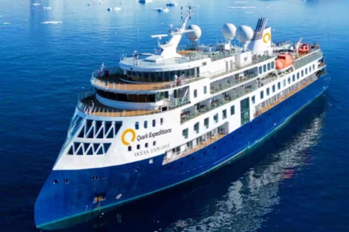 Arctic Explorer Expedition with Ocean Explorer Quest Expeditions Ocean Explorer cruise ship sailing on blue ocean water with white superstructure and blue hull