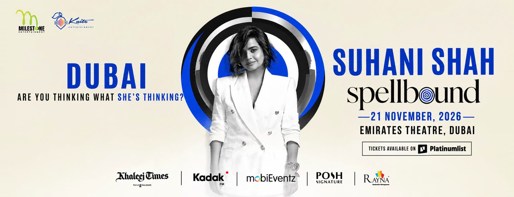 Suhani Shah Spellbound event poster featuring performer in white blazer within circular blue and black design, Dubai 2026 con