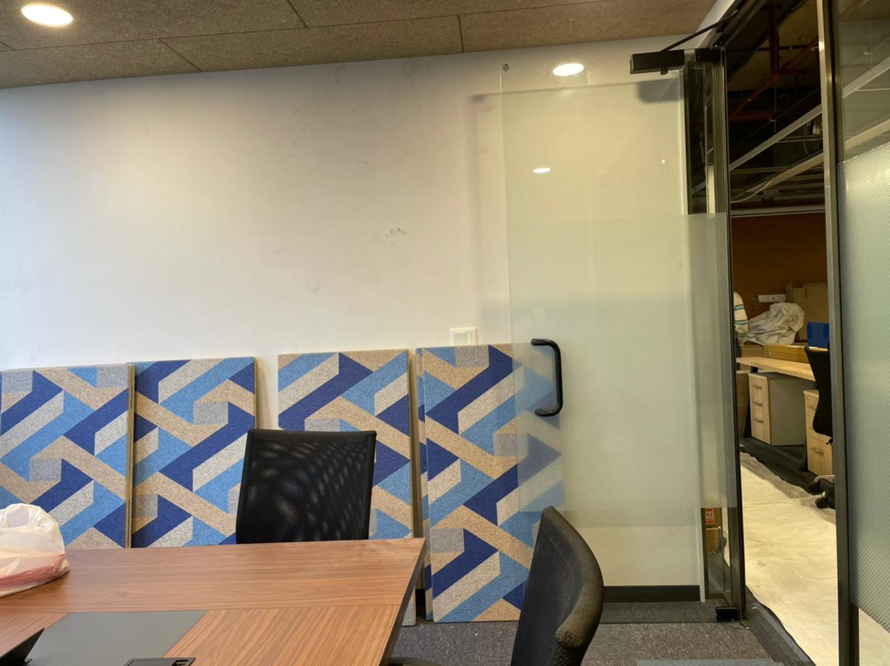 Knauf office meeting room with acoustical treatments and blue accents