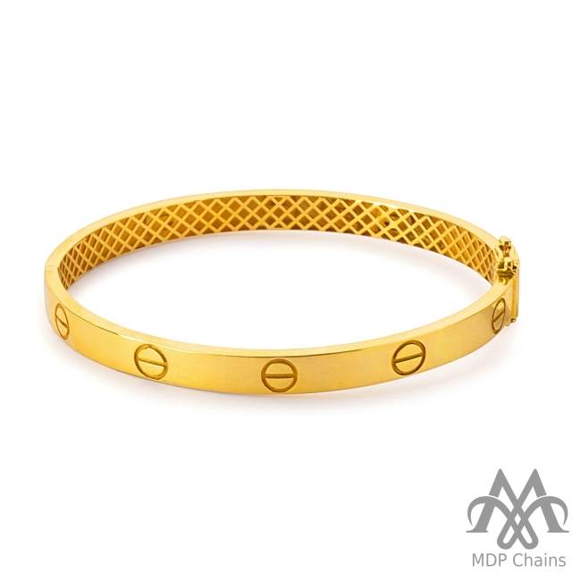 A beautiful 22kt gold Fancy B19 bracelet. This piece has a fancy pattern and a high polish finish. Style tags: kada, modern.