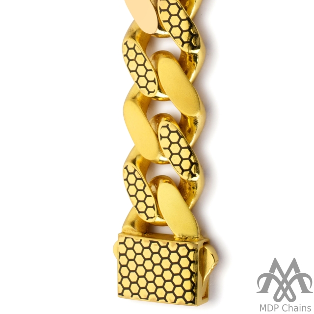 A beautiful 22kt gold Cuban B12 bracelet. This piece has a cuban pattern and a high polish finish. Style tags: football, designer.