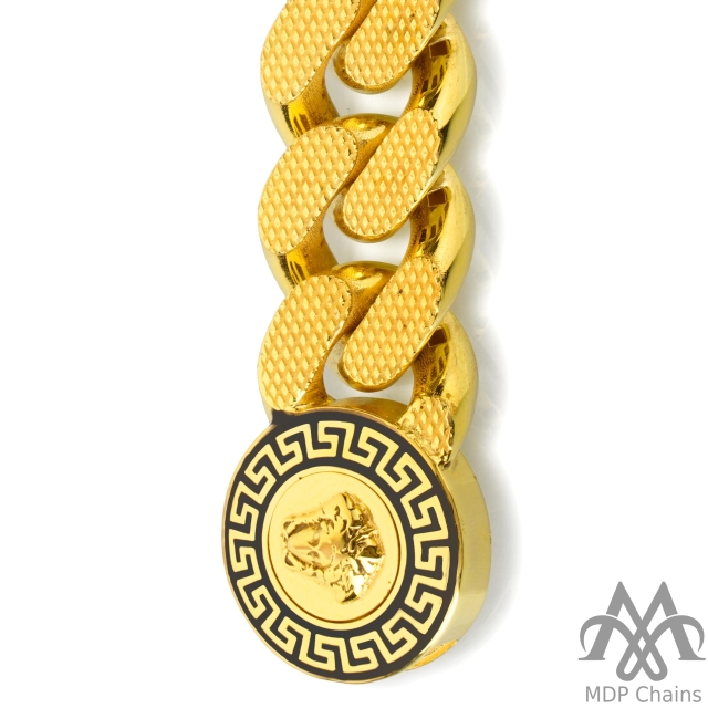 A beautiful 22kt gold Cuban B9 bracelet. This piece has a fancy pattern and a high polish finish. Style tags: designer, textured.