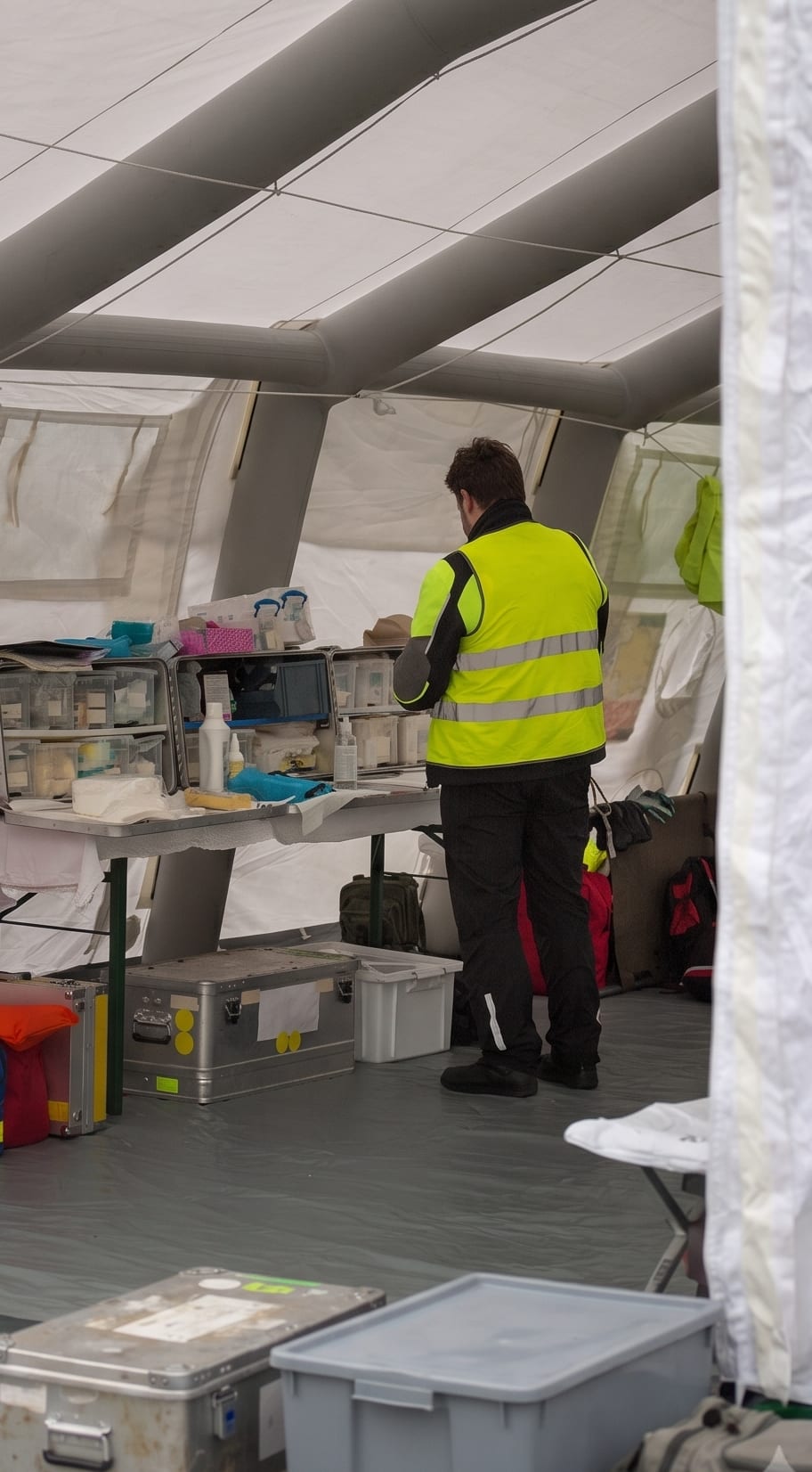 Humanitarian medical volunteer treating a patient at a field clinic