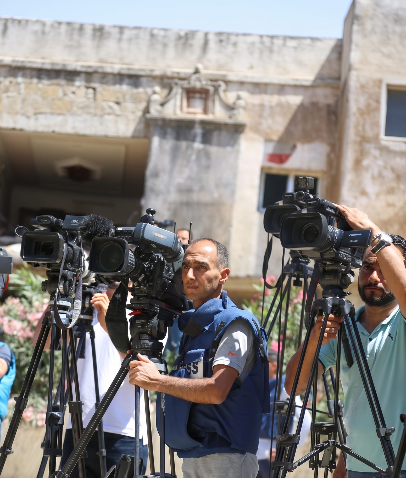 Television news reporter delivering a broadcast from the field