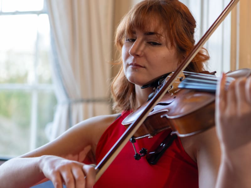 Close-up of Aderyn String Quartet violist playing at a wedding
