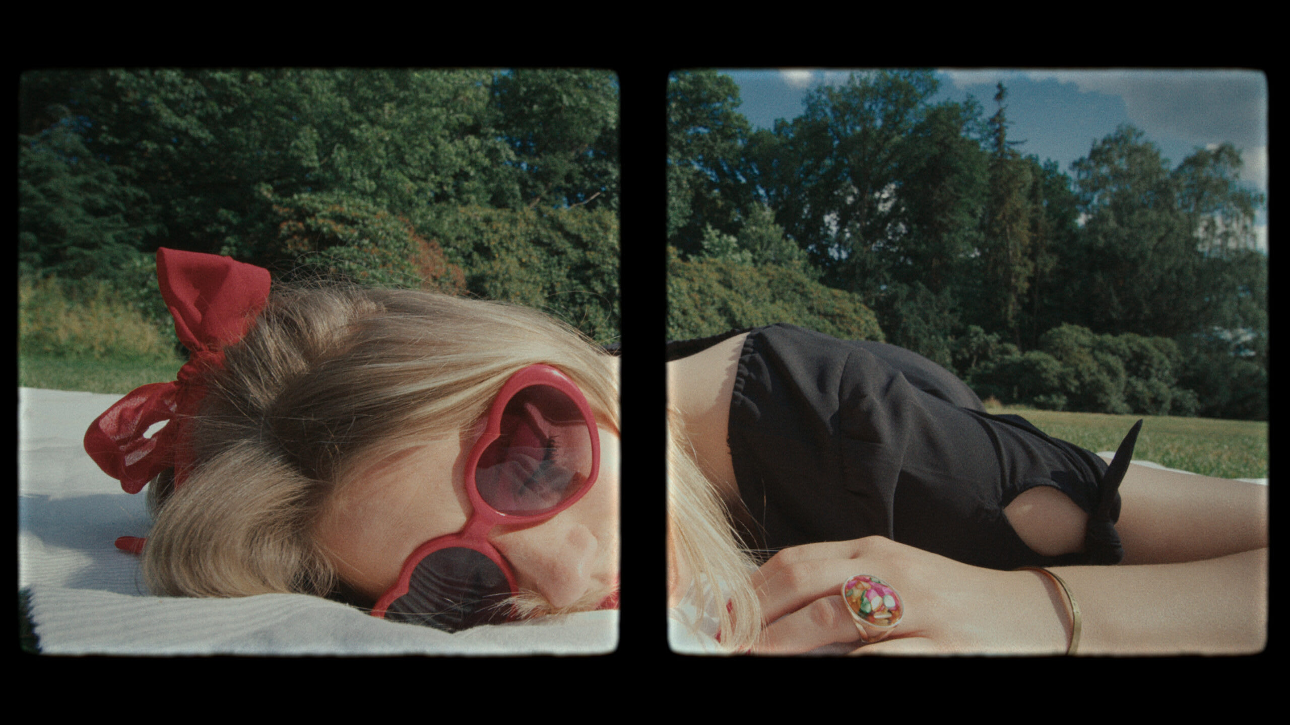 Farbkorrektur einer Frau mit roten Herz-Sonnenbrille, im Grünen liegend.