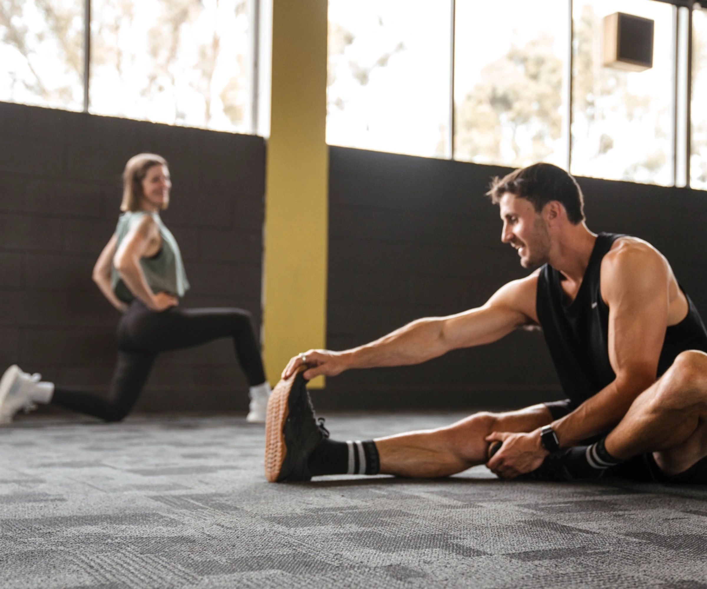 two people doing stretching exercises