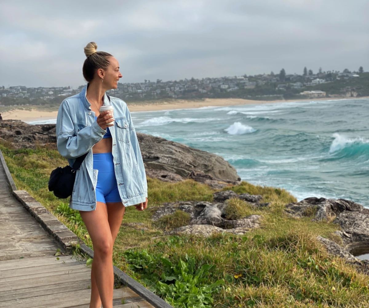 Bulk Nutrients Ambassadors Kylie Gilbert walking along boardwalk beside the water