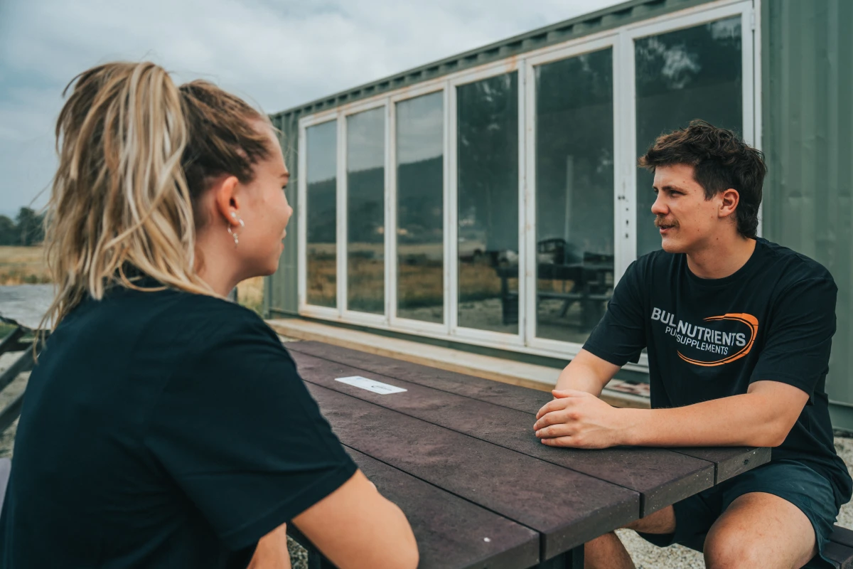 Bulk Nutrients staff sitting at the RedCycle table