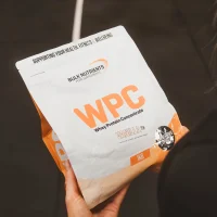 Over the shoulder view of customer holding a bag of WPC