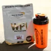 A bag of WPI sits next to a Bulk Nutrients shaker