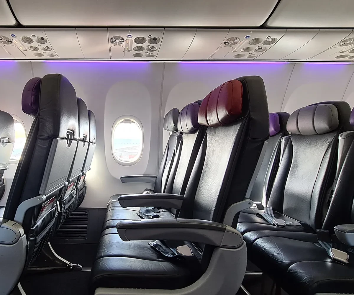 Row of empty seats on a plane.