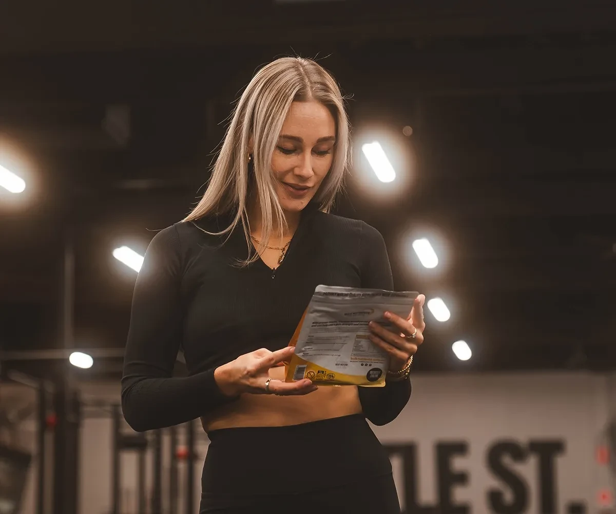 Bulk Nutrients Ambassador Chelsea Reid reading the information on the product