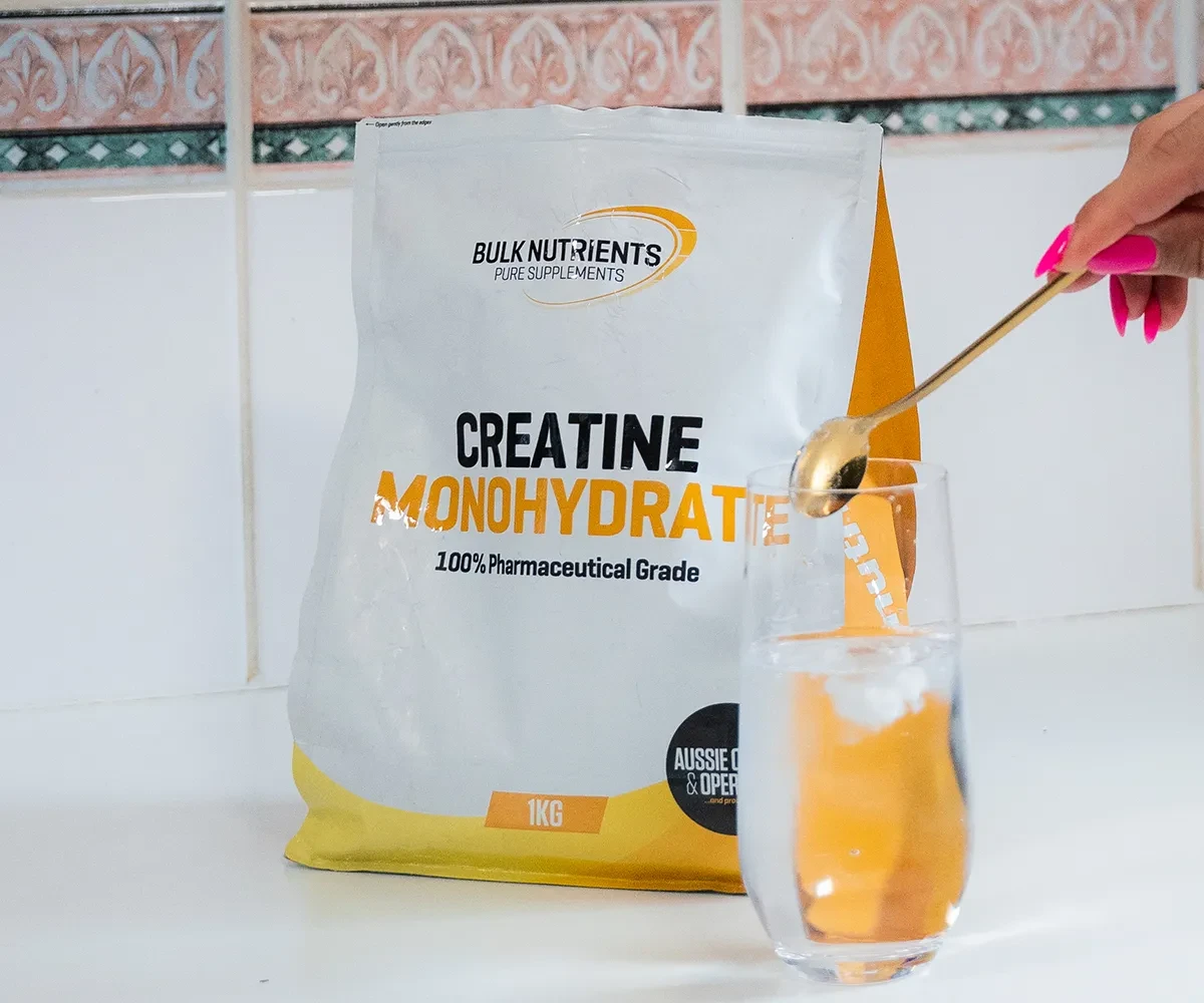 Bulk Nutrients Creatine Monohydrate being put in to a glass of water