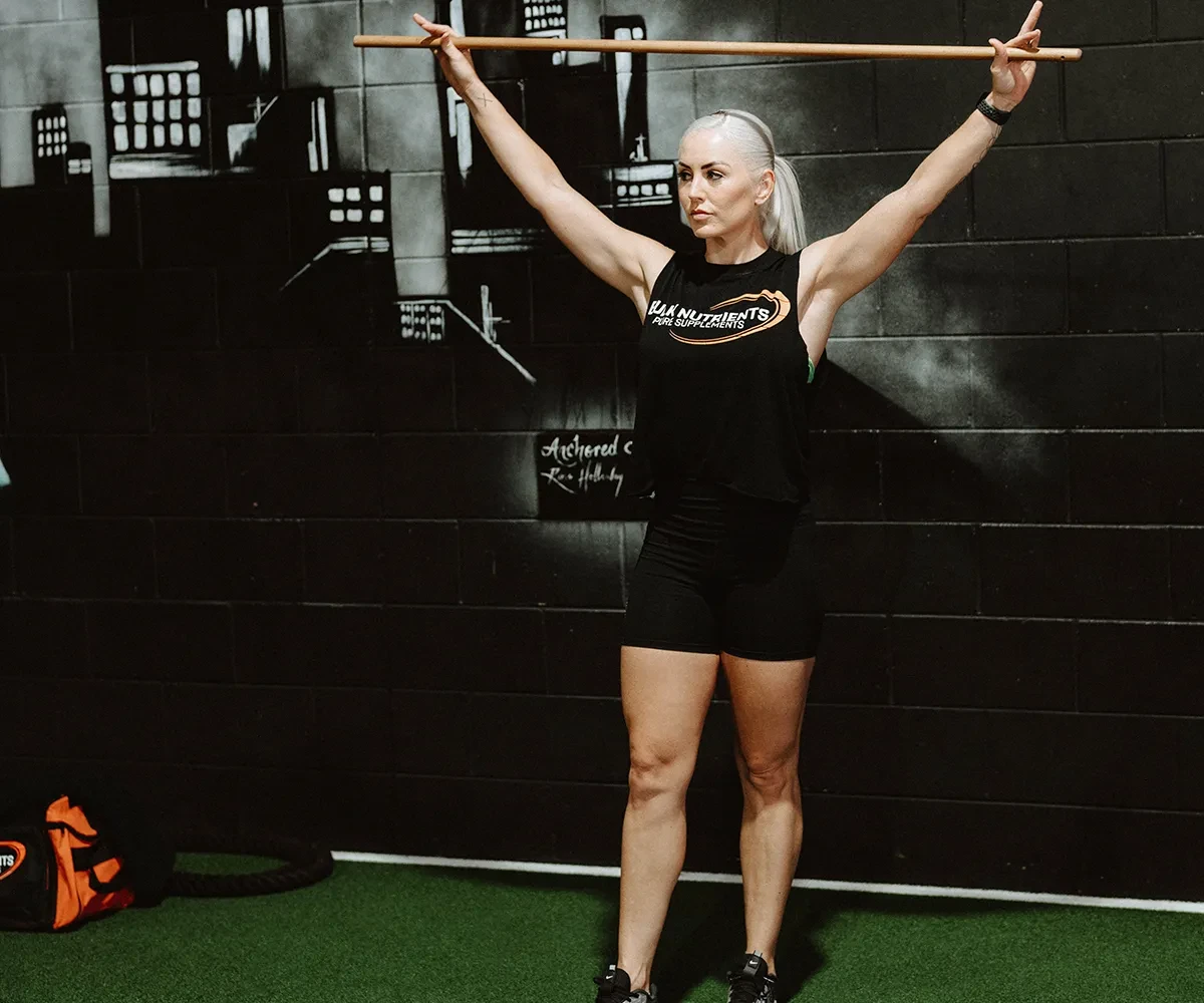 Bulk Nutrients Ambassador Tarran Lee with wooden pole in the gym