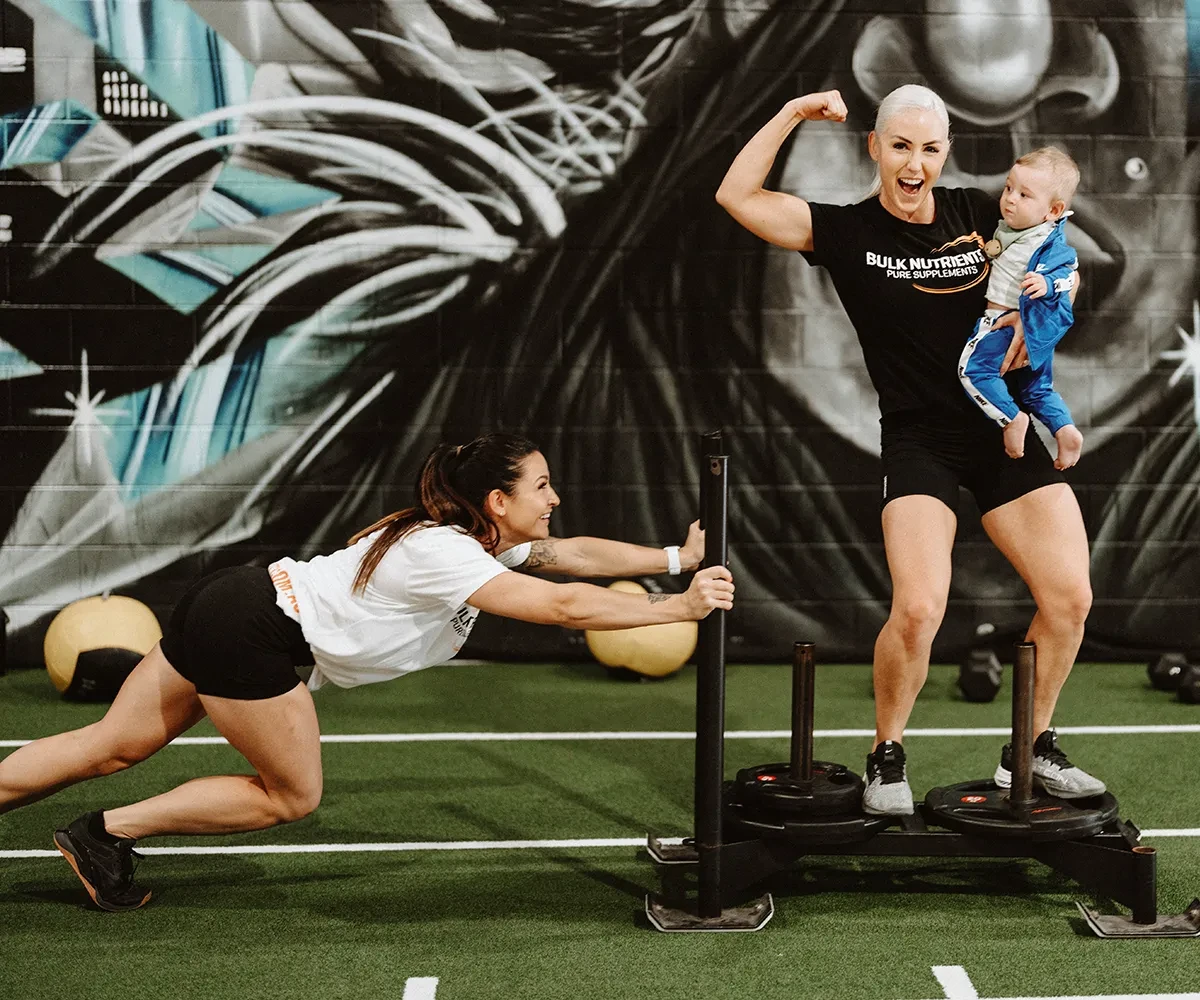 Bulk Nutrients Ambassador Tammie Sarkozy and Tarran Lee in the gym with sled