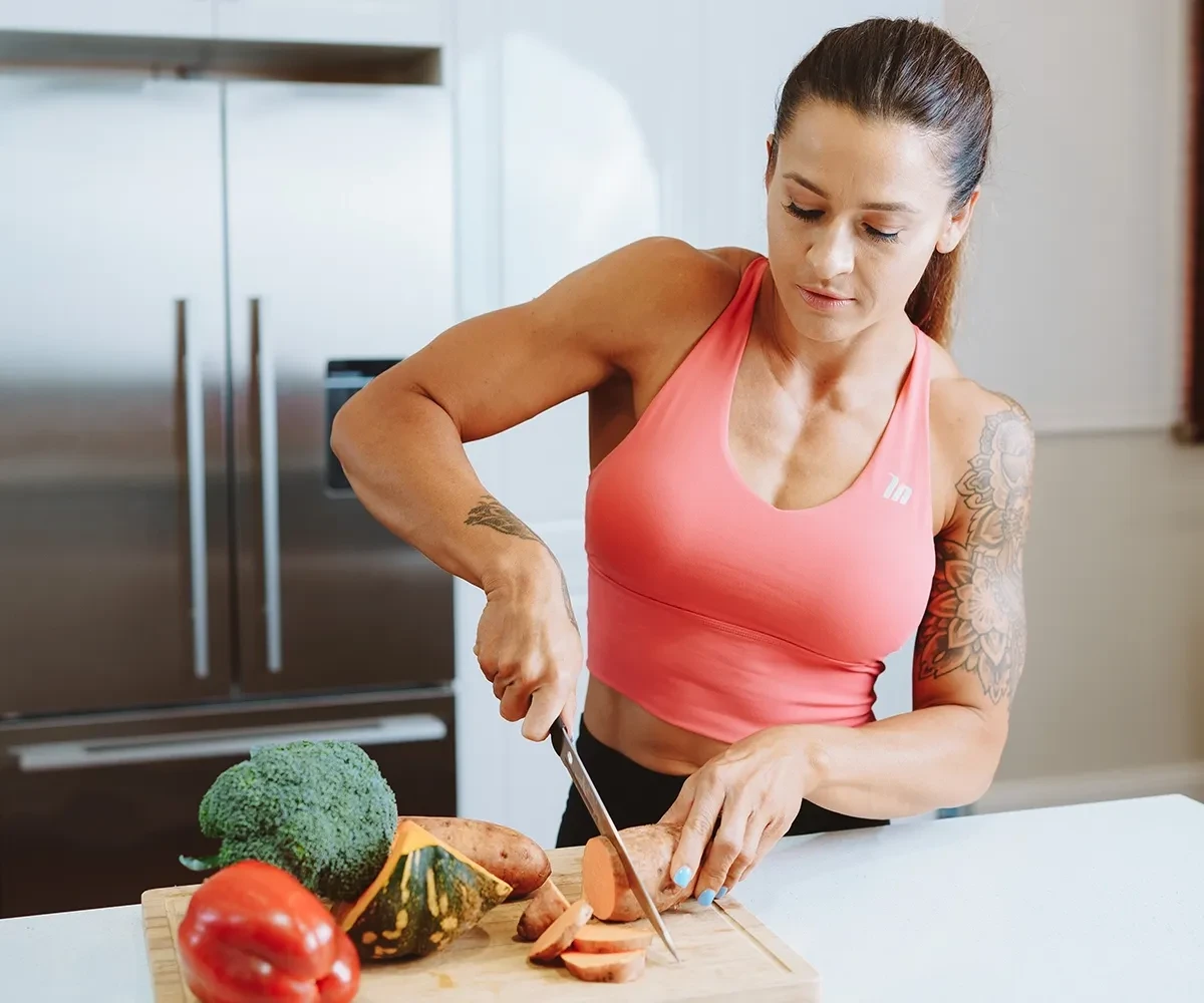 Bulk Nutrients Ambassador Tammie Sarkozy chopping vegetables on a table