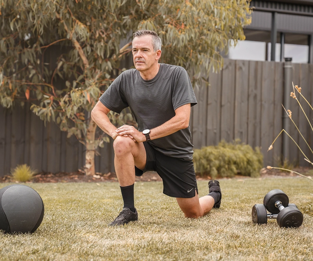 Longevity - Man in the backyard stretching