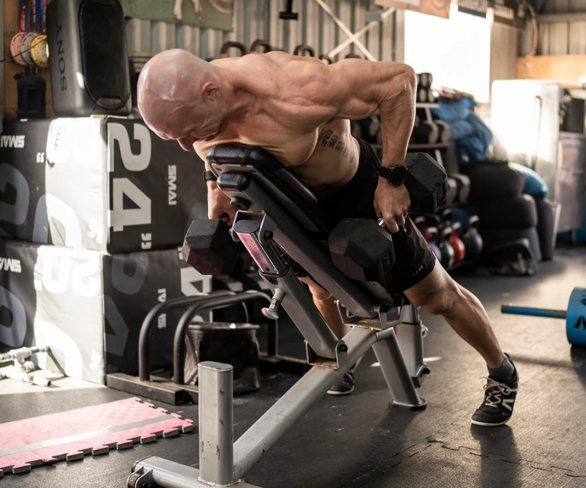 Bulk Nutrients Ambassador Bobby Dee pulling weights on a bench
