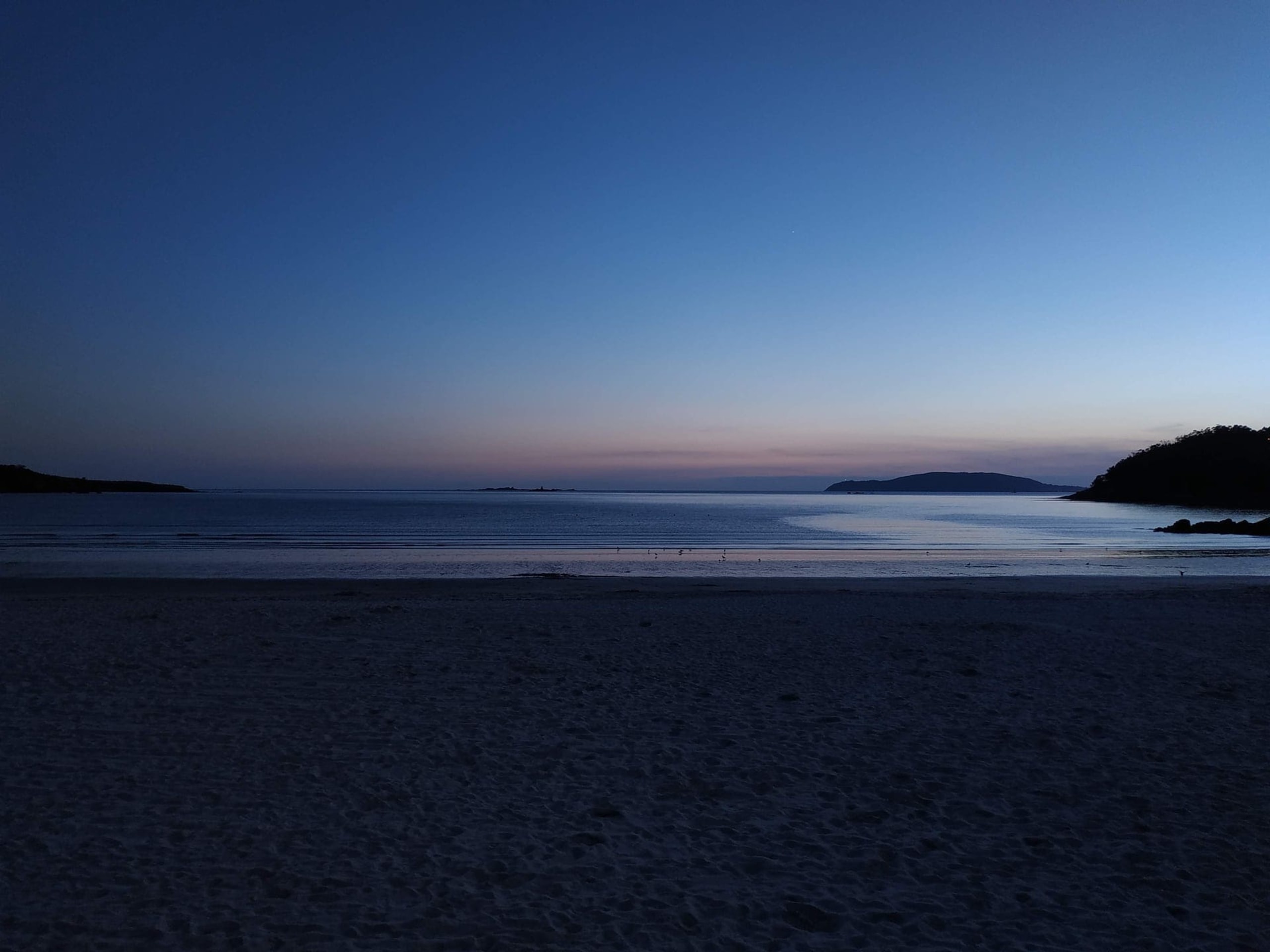 Fotografía de Dumbría que muestra playa y atardecer.