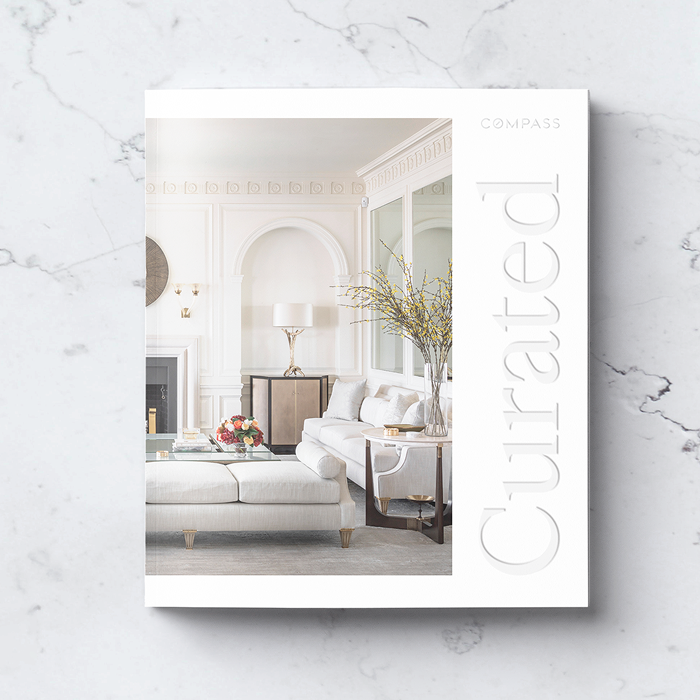 a photograph of 3 copies of the same book, lined up at an angle and laying flat on a black background. The book is titled: The Guide to Product Analytics. It is a black hardcover book with metallic silver foil debossing