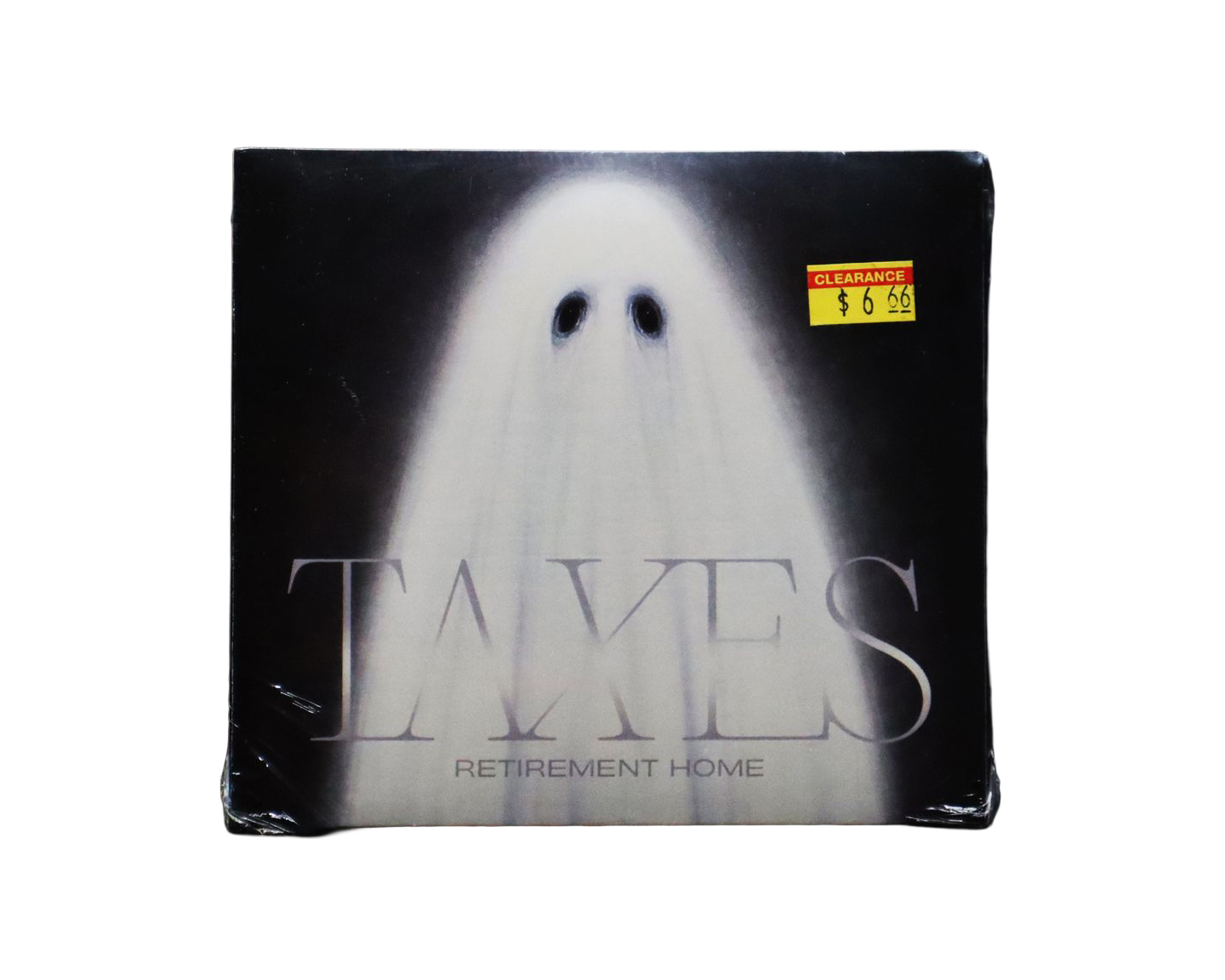 Photo of the CD angled at a distance on a back background. The CD cover has a painting of a ghost on it with the band name somewhat hidden in the fabric of the ghost