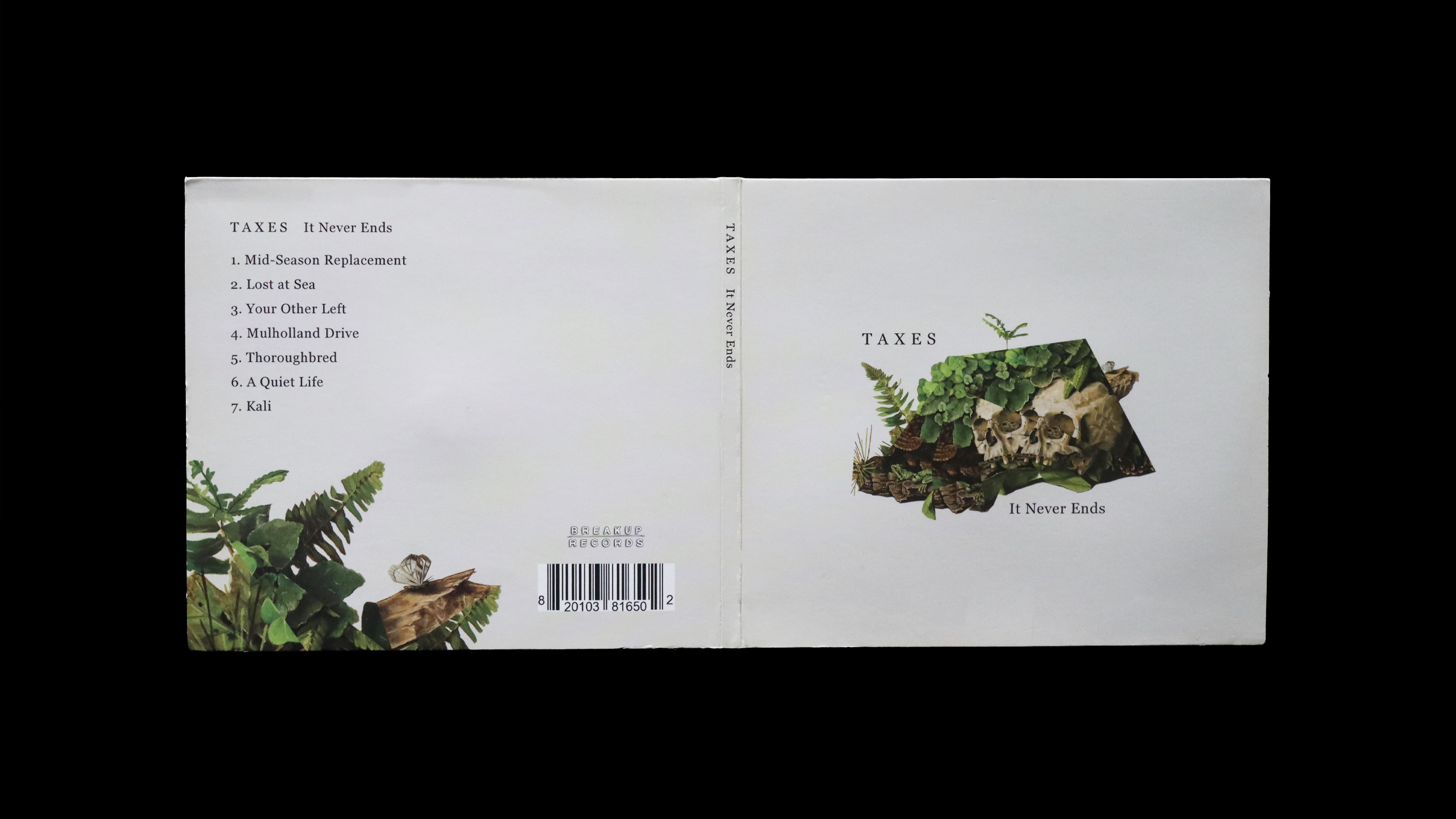 Top-down shot of the CD open but flipped so the cover and back show