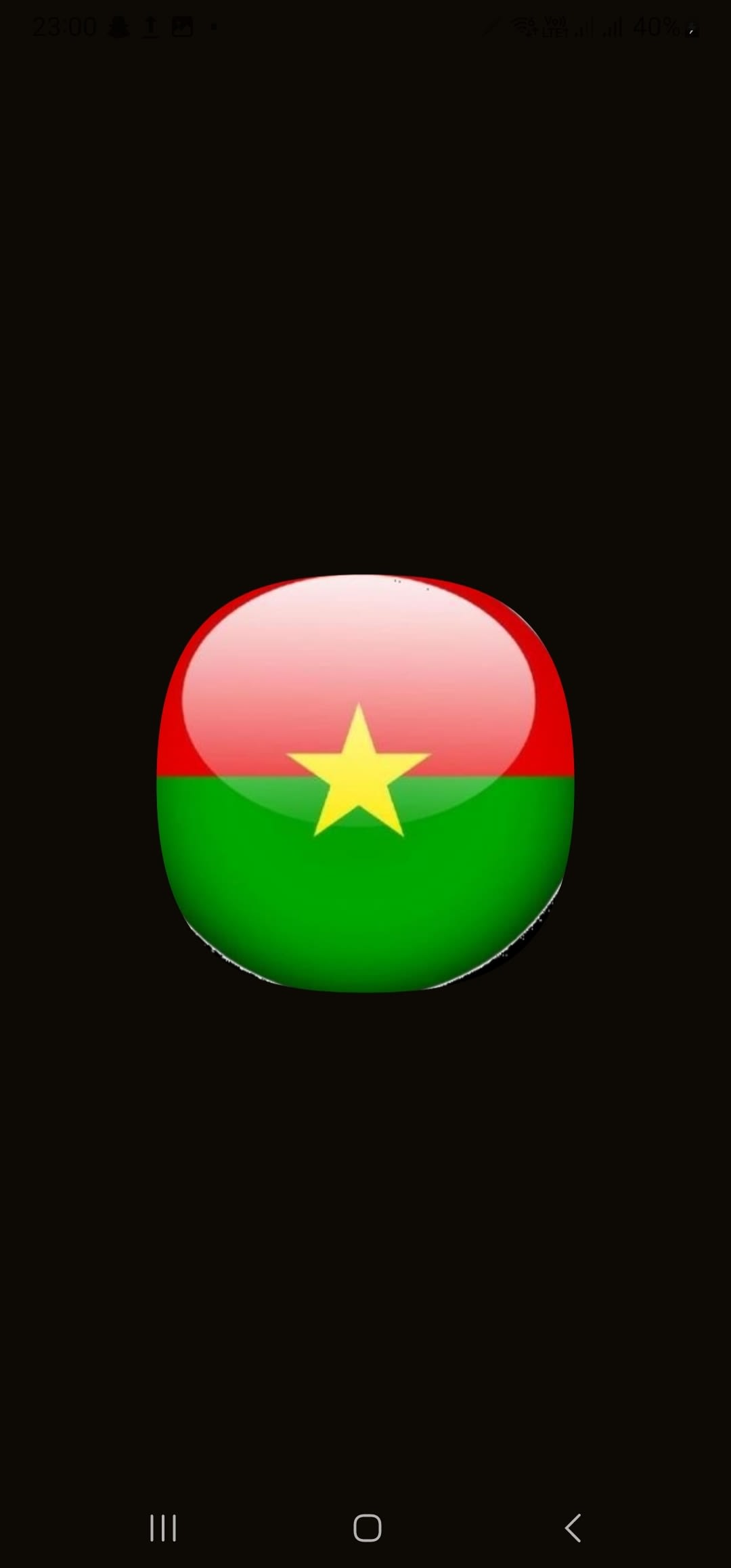 Icône ronde et brillante du drapeau du Burkina Faso sur fond noir