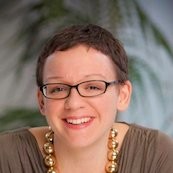 Katie Martin smiling - her teeth are not worth that much