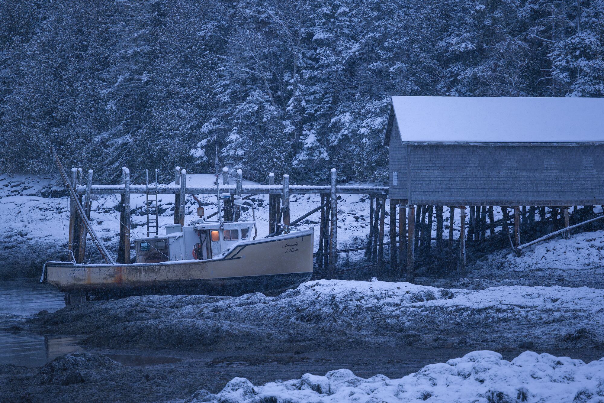 Dragger at Pier in Snow